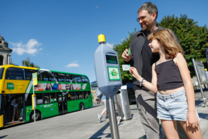 girl and dad at Luas validator with child 5-8 TFI Leap card 02 900x600