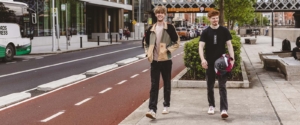 two men walking near cycle lane in Dublin street