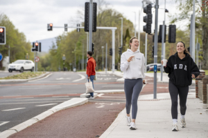two walkers chatting smiling with coffee in Limerick